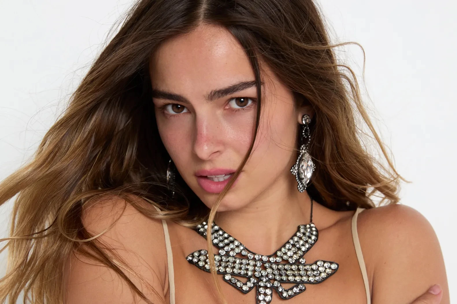 Editorial gallery of Addison Rae styled in warm spring looks packed with coral, turquoise, and golden accents, highlighting peach, lemon, turquoise, coral, and ivory.