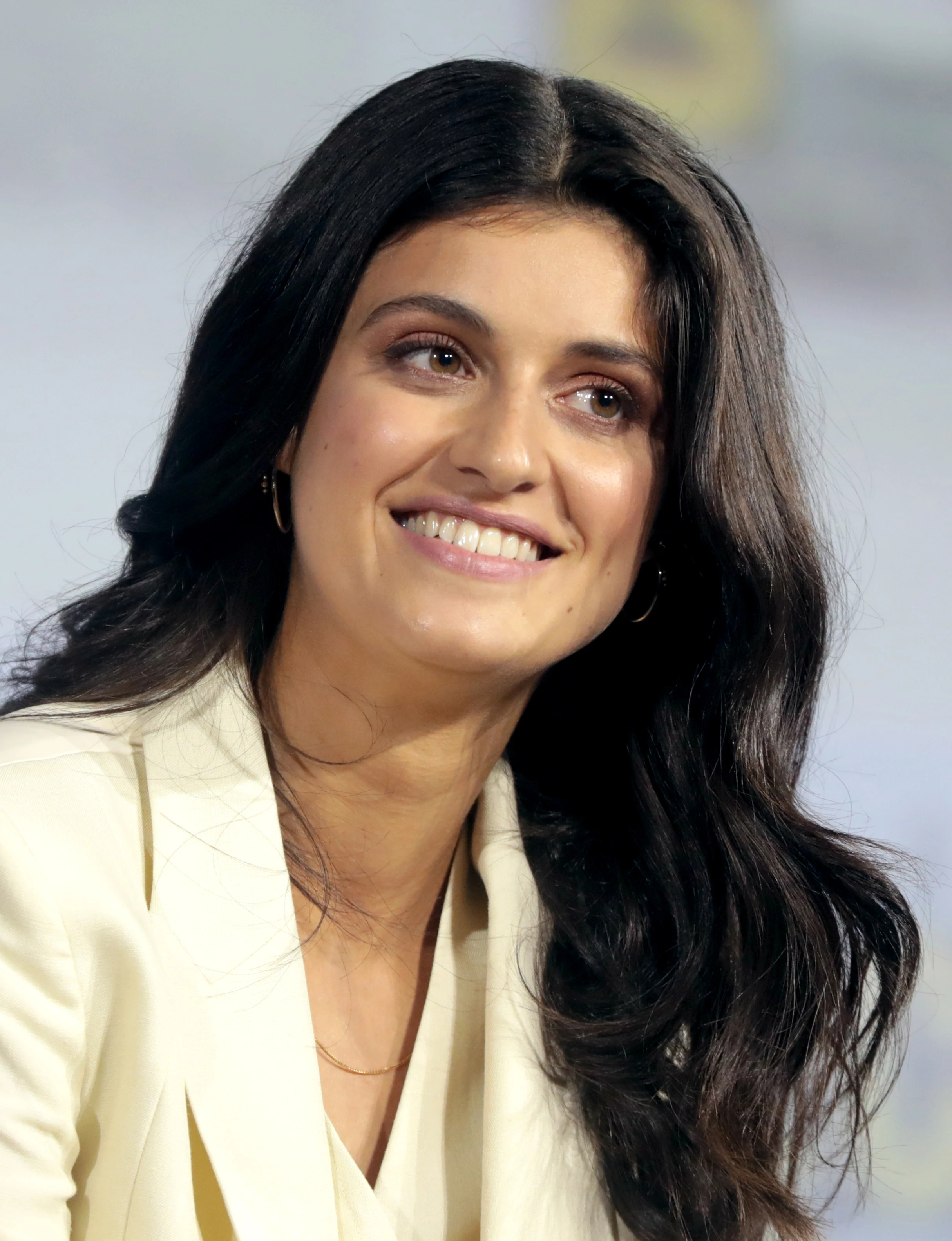 Anya Chalotra wearing velvety pastel looks with cool-muted tones, showcasing heather gray, dusty mauve, mist blue, slate green, and antique silver from the Soft Summer palette.