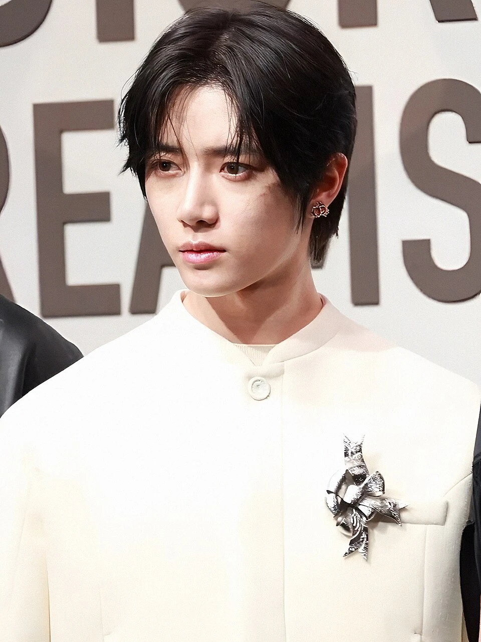 Editorial gallery of Beomgyu (TXT) styled in cool winter outfits featuring sapphire, amethyst, and inky neutrals, highlighting glacier blue, raspberry, graphite, arctic white, and ultra black.