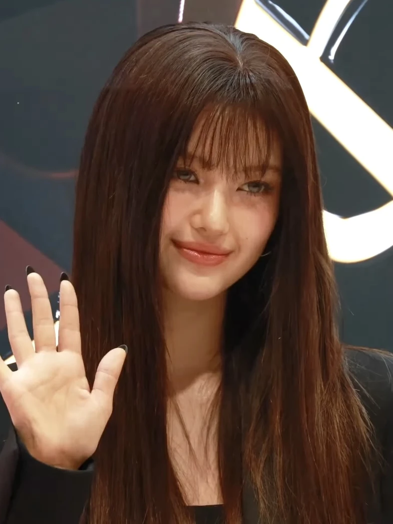 Danielle (NewJeans) wearing balanced jewel-toned looks with cool neutrals, showcasing steel blue, cranberry, optic white, graphite, and imperial purple from the Neutral Winter palette.