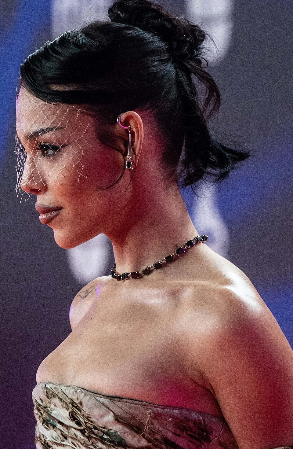 Danna Paola wearing luminous spring outfits with juicy warm hues, showcasing papaya orange, sunny marigold, aqua turquoise, creamy ivory, and rose gold from the Warm Spring palette.