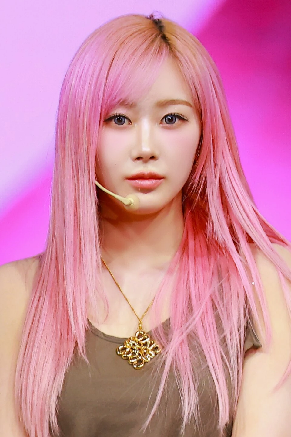 Giselle (aespa) wearing high-voltage winter ensembles with electric hues and chrome accents, showcasing fuchsia, royal blue, silver chrome, acid lime, and deep plum from the Vibrant Winter palette.