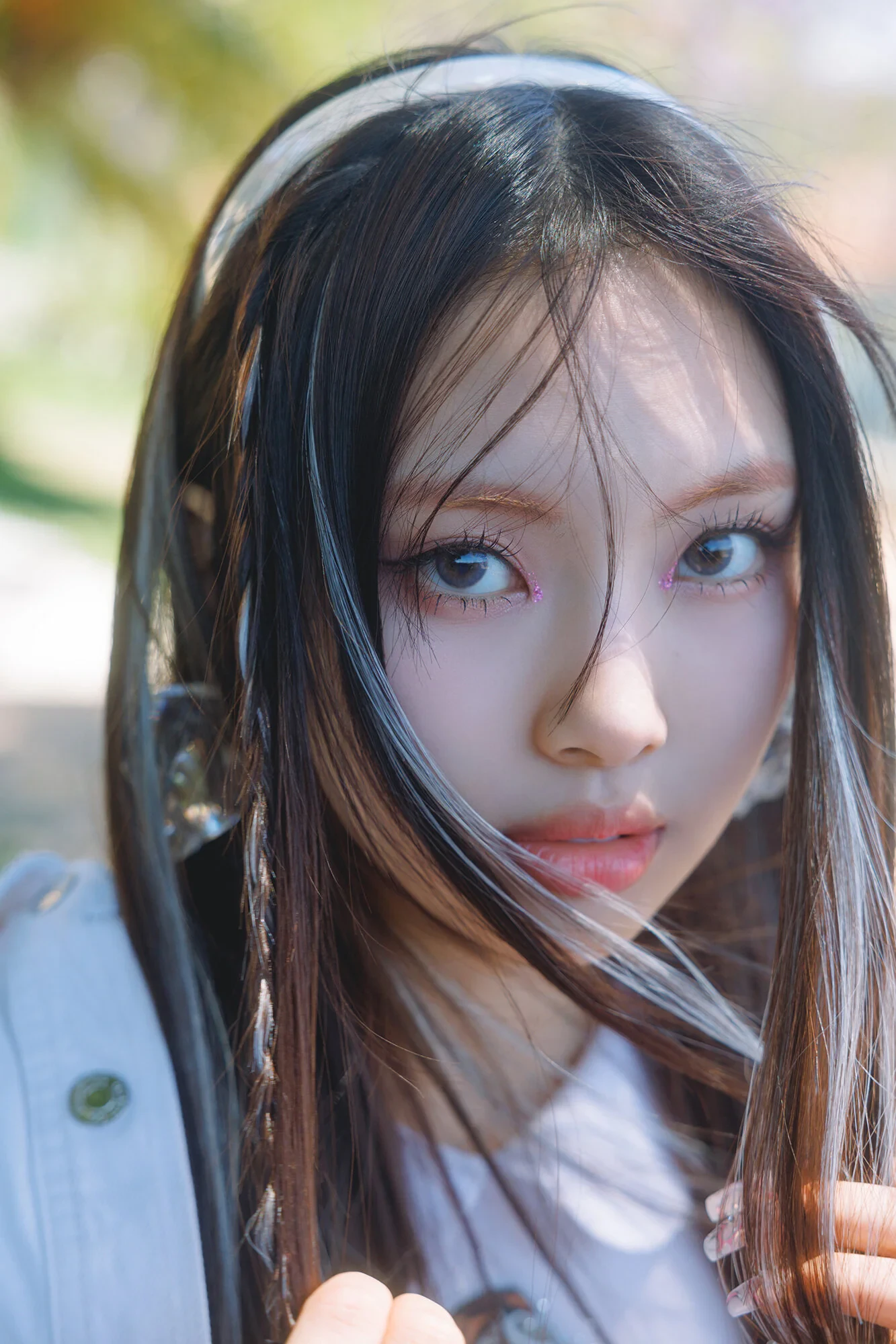 Editorial gallery of Hyein (NewJeans) styled in vibrant winter looks mixing neon brights, sharp blacks, and metallic shine, highlighting fuchsia, royal blue, silver chrome, acid lime, and deep plum.