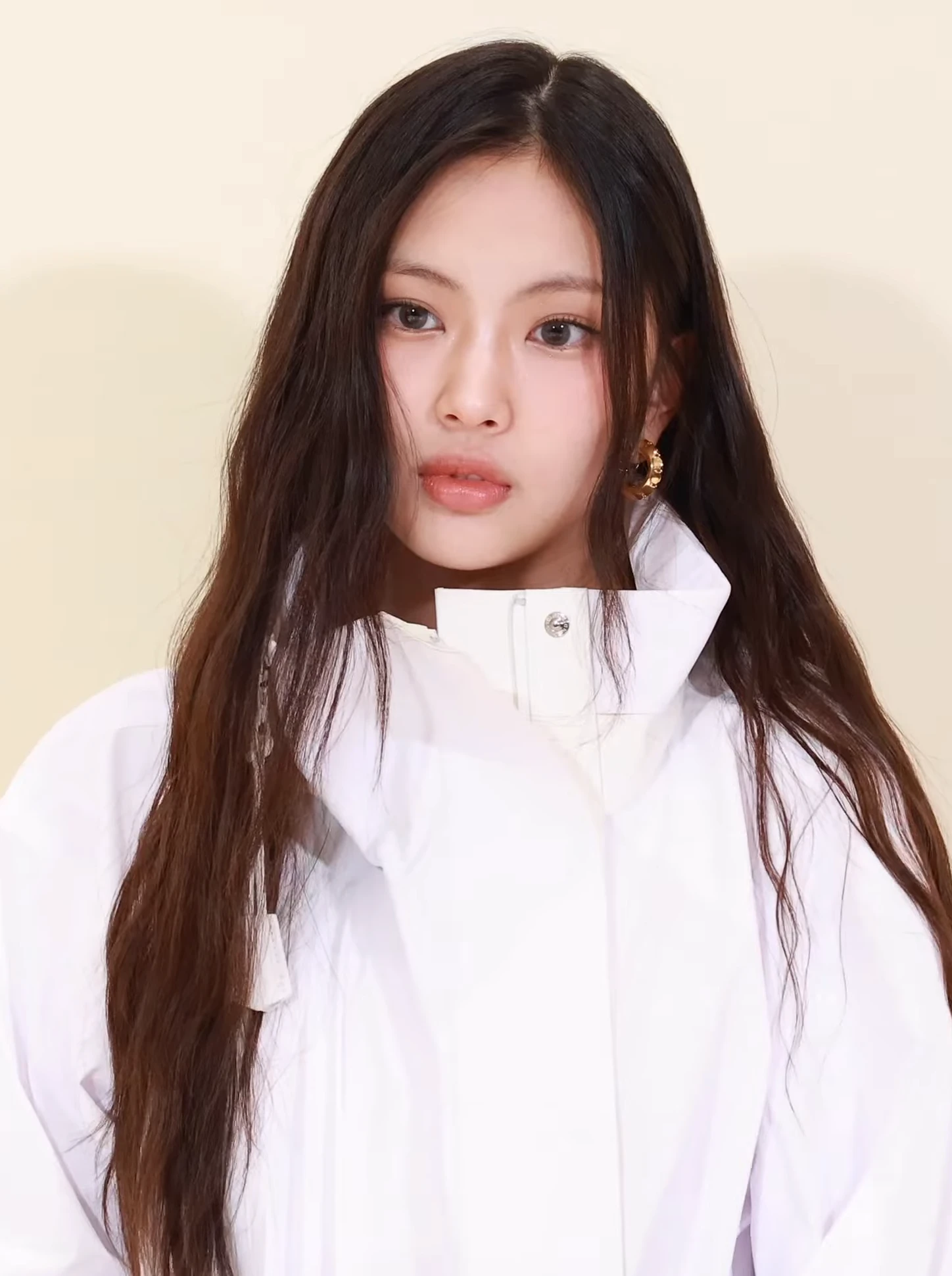 Hyein (NewJeans) wearing high-voltage winter ensembles with electric hues and chrome accents, showcasing fuchsia, royal blue, silver chrome, acid lime, and deep plum from the Vibrant Winter palette.