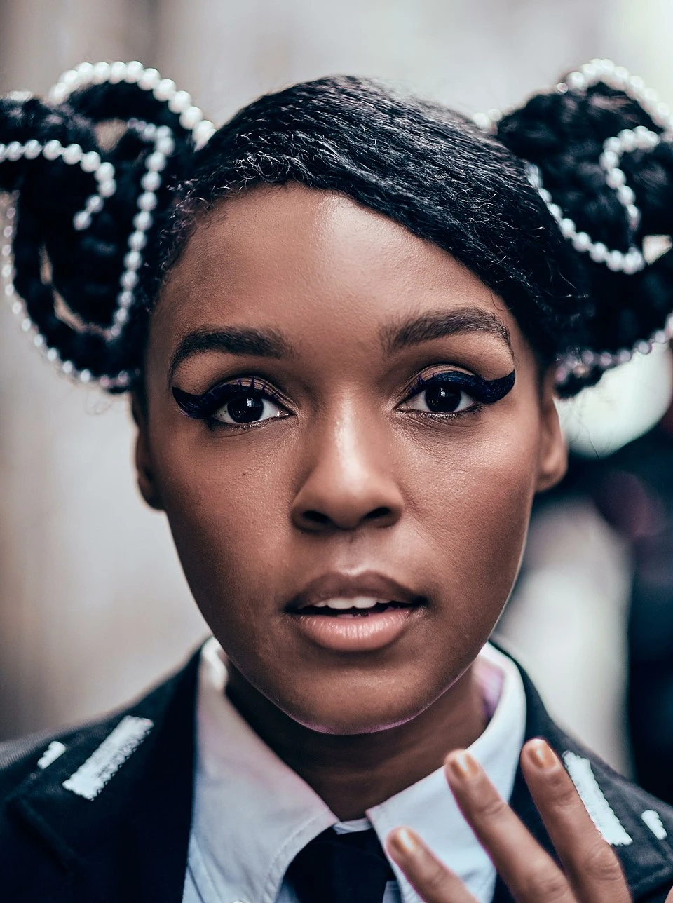 Janelle Monáe wearing airy pastel ensembles with soft tailoring, showcasing sky blue, cool blush, opal gray, mint chiffon, and soft navy from the Light Summer palette.