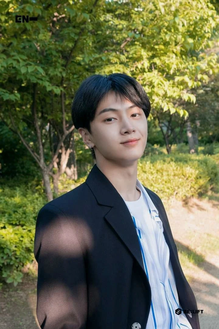 Editorial gallery of Jay (ENHYPEN) styled in bold winter ensembles mixing neon pops, inky black, and chrome sparkle, highlighting ultra violet, neon fuchsia, electric jade, polished pewter, and onyx.