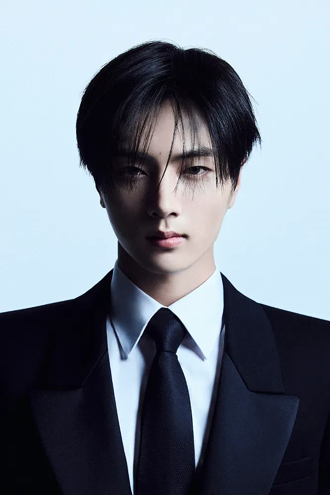 Jay (ENHYPEN) wearing high-contrast electric brights paired with sharp tailoring, showcasing ultra violet, neon fuchsia, electric jade, polished pewter, and onyx from the Bold Winter palette.