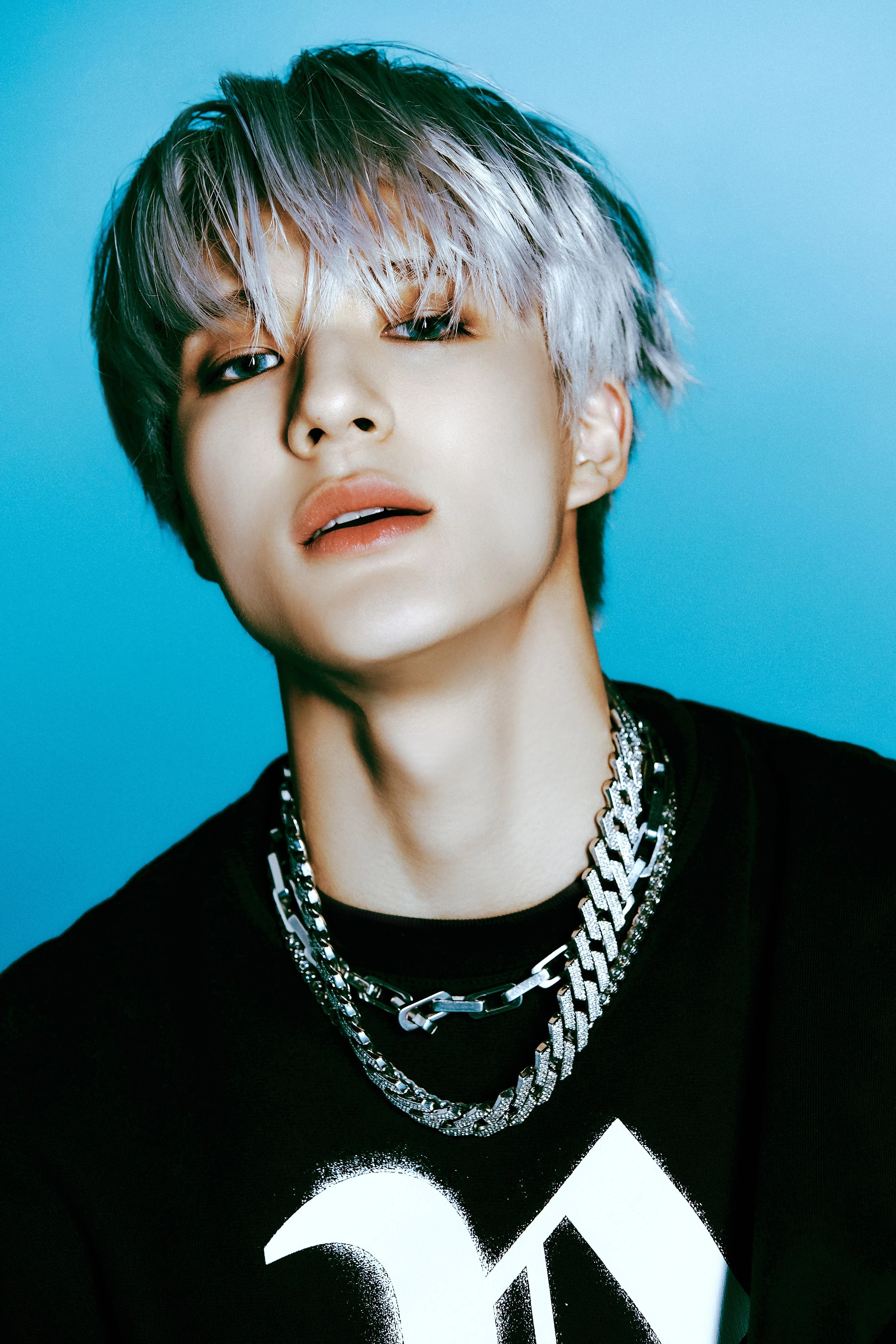 Editorial gallery of Jeno (NCT) styled in deep winter looks featuring sapphire, garnet, and chrome accents, highlighting midnight navy, crimson, amethyst, gunmetal, and snow white.