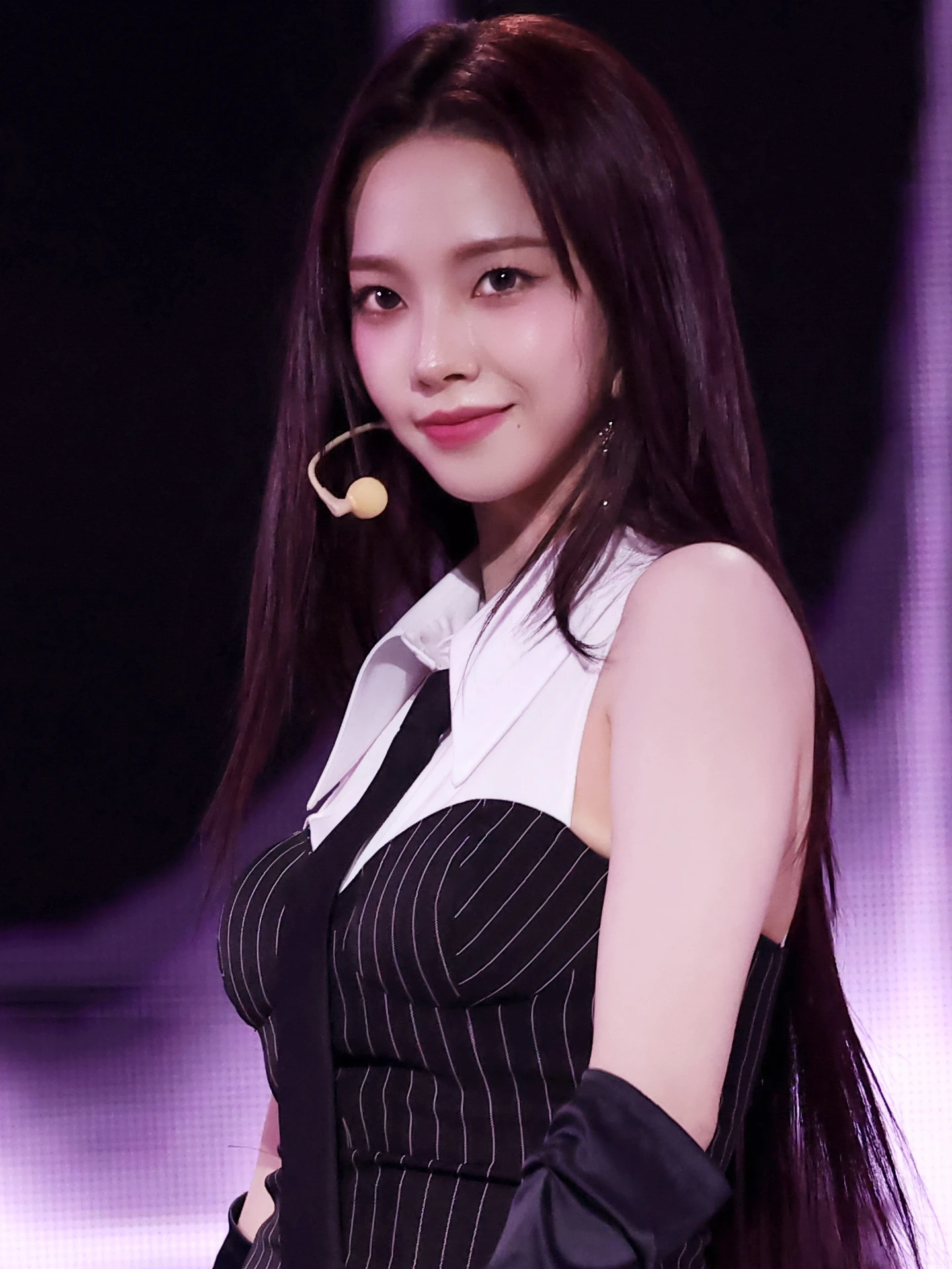 Karina (aespa) wearing jewel-toned statement dressing with crisp contrast and sparkle, showcasing electric cobalt, icy magenta, optic white, chrome silver, and inky black from the Bright Winter palette.