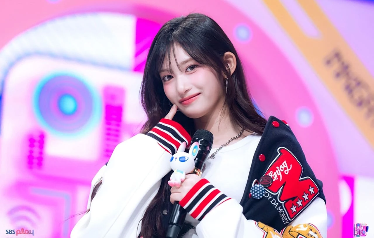 Editorial gallery of Leeseo (IVE) styled in bright winter looks with electric blues, magenta accents, and polished black, highlighting electric cobalt, icy magenta, optic white, chrome silver, and inky black.