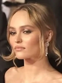 Editorial gallery of Lily-Rose Depp styled in soft summer outfits blending dusty mauve, mist blue, and slate neutrals, highlighting powder pink, dusty lilac, mist gray, soft navy, and rose beige.