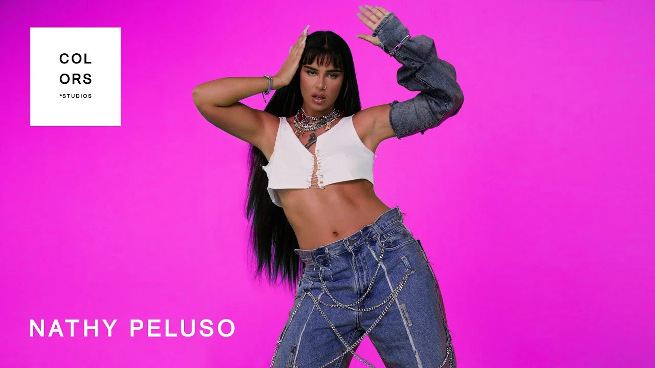 Editorial gallery of Nathy Peluso styled in misty blue and lavender ensembles accented with silver sparkle, highlighting bluebell, lavender mist, storm gray, cool teal, and soft navy.