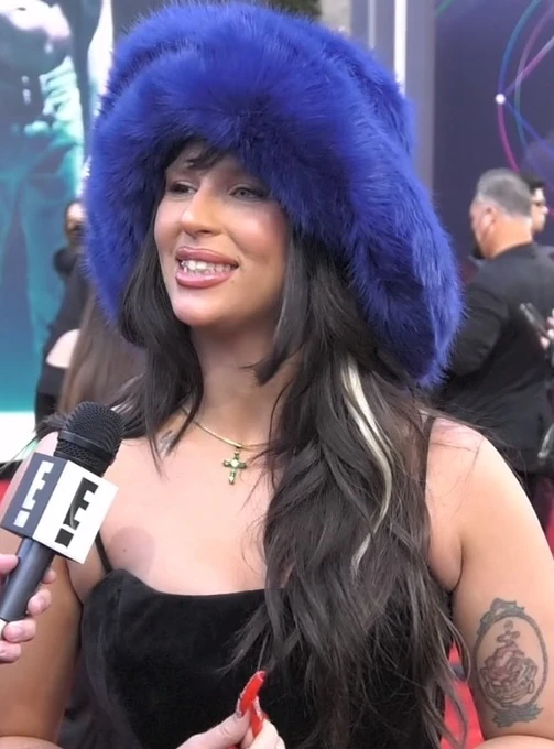 Nathy Peluso wearing icy pastel tailoring with soft shimmer, showcasing bluebell, lavender mist, storm gray, cool teal, and soft navy from the Cool Summer palette.