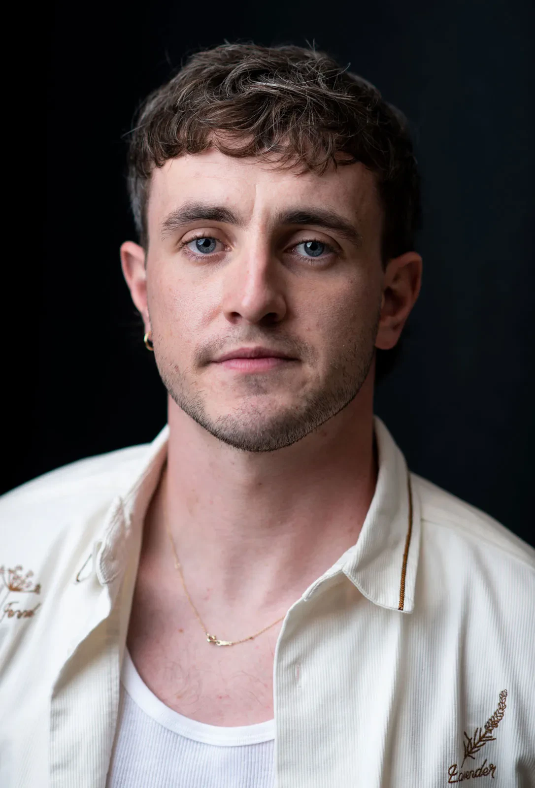 Paul Mescal wearing cool-toned looks with berry accents and fluid movement, showcasing powder blue, soft lilac, rose quartz, silvery sage, and midnight plum from the True Summer palette.