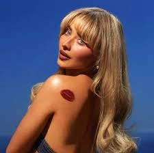 Editorial gallery of Sabrina Carpenter styled in warm spring looks packed with coral, turquoise, and golden accents, highlighting butterscotch, peach, turquoise, creamy ivory, and bubblegum pink.