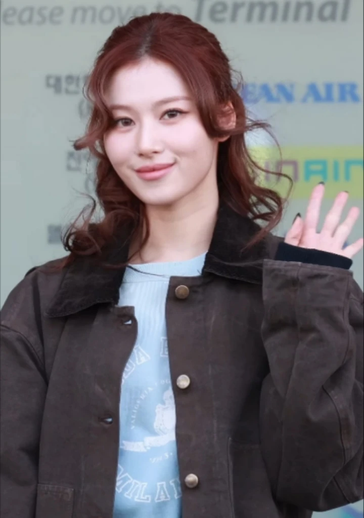 Sana (TWICE) wearing balanced jewel-toned looks with cool neutrals, showcasing steel blue, cranberry, optic white, graphite, and imperial purple from the Neutral Winter palette.