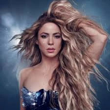 Editorial gallery of Shakira styled in warm spring looks packed with coral, turquoise, and golden accents, highlighting papaya orange, sunny marigold, aqua turquoise, creamy ivory, and rose gold.