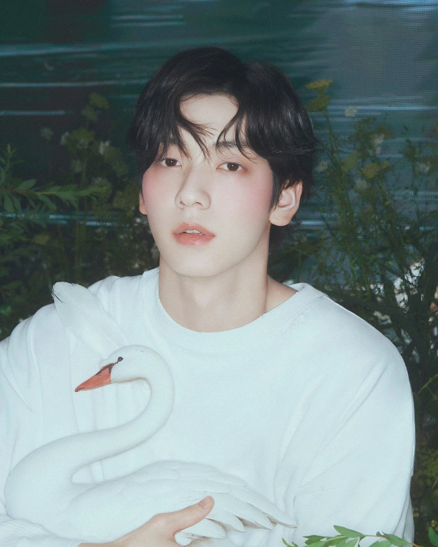 Editorial gallery of Soobin (TXT) styled in bold winter ensembles mixing neon pops, inky black, and chrome sparkle, highlighting ultra violet, neon fuchsia, electric jade, polished pewter, and onyx.