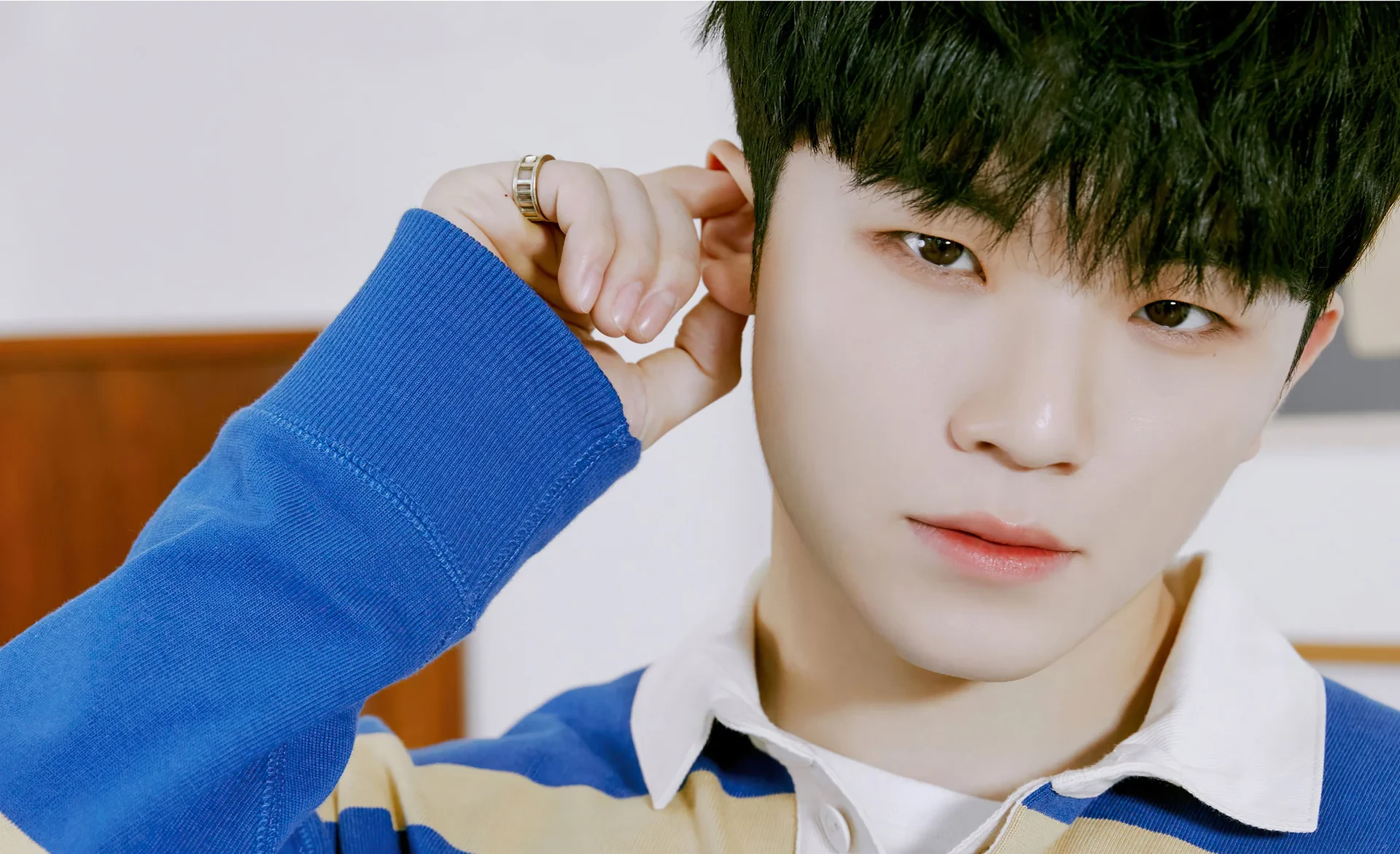 Editorial gallery of Woozi (SEVENTEEN) styled in cool winter outfits featuring sapphire, amethyst, and inky neutrals, highlighting glacier blue, raspberry, graphite, arctic white, and ultra black.